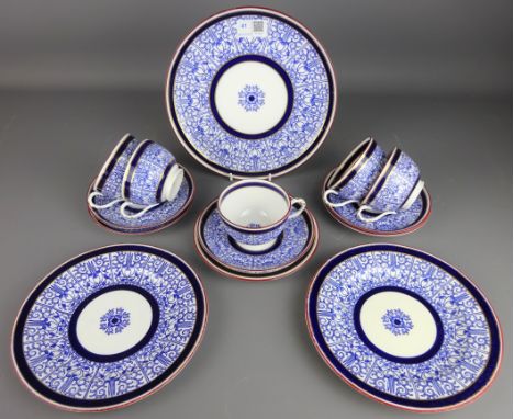 Early 20th Century Royal Worcester 'Royal Lily' pattern teaware; five cups and saucers, one tea plate, two side plates and ca