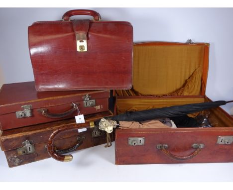 Three vintage leather travel cases containing vintage clothing and umbrellas and vintage leather brief case    Condition Repo