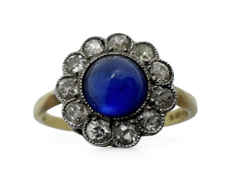 An 18ct gold diamond and synthetic sapphire dress ring, converted from an Edwardian tie pin.  Featuring a verneuil flame fusi