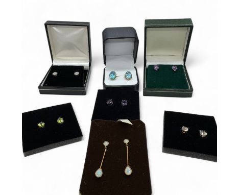 A collection of five pairs of gold gem set studs, together with two pairs of silver gem set earrings. Comprising a pair of 0.