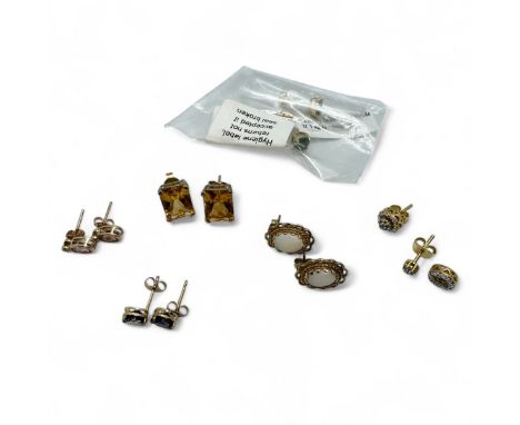 A collection of gold gem set earrings to include four pairs in 9ct gold and two pairs in gilt silver. Comprising a pair of 9c