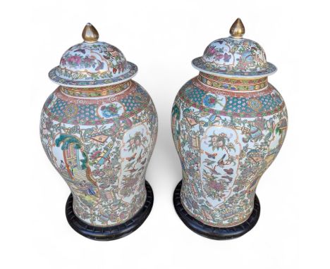 Two large, modern Chinese ginger jars with raised enamel detail and two pairs of stands.   Height approximately 50cm high by 