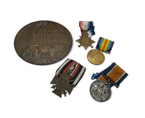 A World War One memorial plaque or "death penny" together with a 1914 Trio and a German Honour Cross of World War 1914-18. Th