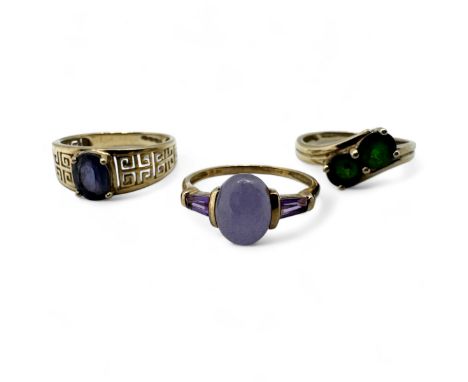 Three 9ct gold dress ring. A chrome diopside set crossover ring, size S; a purple crackle dye quartzite and amethyst dress ri