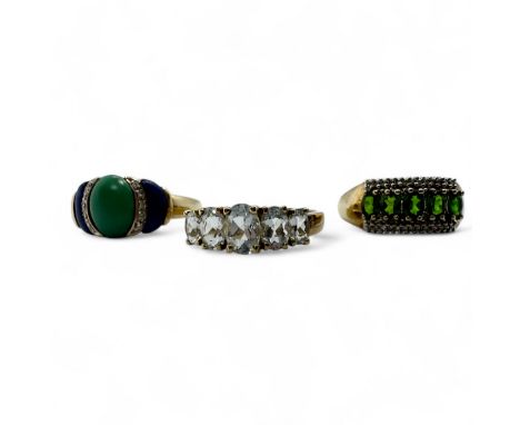 Three 9ct gold gem set rings.  To include a blue and green hardstone and diamond ring, size S; a five stone aquamarine ring, 