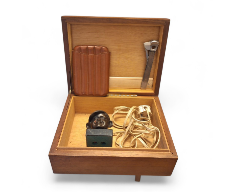 A smoking related group to consist of a wooden cigar box, a leather cigar case and a bronzed effect cigar lighter in the form