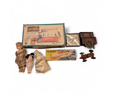 A collection of tin toys x 5 & 3 small dolls (8) A boxed Dinky Toy D-A URE aeroplane game called Gliding A tin fair ground tr