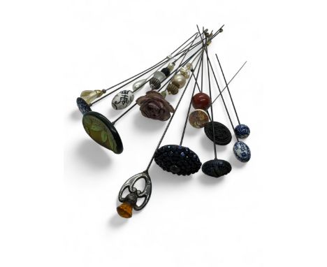 A collection of 17 hat pins, to include a sterling silver topped Scottish style example marked for Charles Horner, Chester, 1