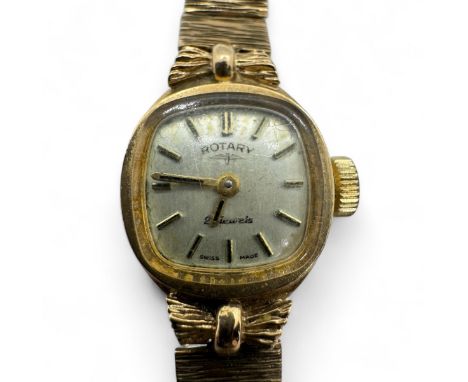 A vintage 9ct gold Rotary ladies cocktail watch with 9ct gold textured link bracelet.  With champagne dial, with baton marker