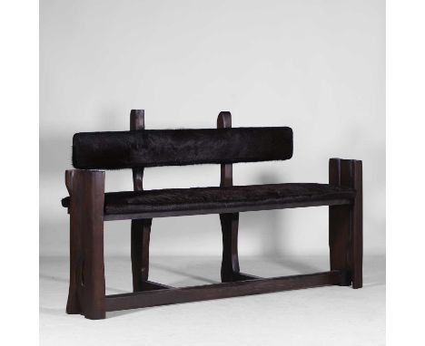 Brutalist, a stained wood bench, 1970s, French, the upholstery of dyed cowhide,162cm wide56cm deep93cm high