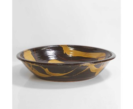 ▲ Clive Bowen (b.1943), a large slipware charger with trailed decoration, slip-glazed earthenware,58.3cm diameter12cm high