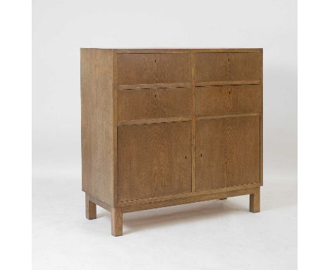1960s, an oak cabinet, Danish, 1960s, of rectangular form, with four drawers above two cupboards, raised on four feet,94cm wi