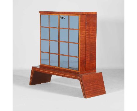 Manner of Osvaldo Borsani, a wooden veneered and mirrored drinks cabinet, 1950s, Italian, opening to mirrored shelving, with 
