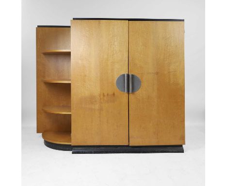 Art Deco, a sycamore wardrobe, with a bank of curved shelves to the left-hand side, the doors with metal tube handles mounted