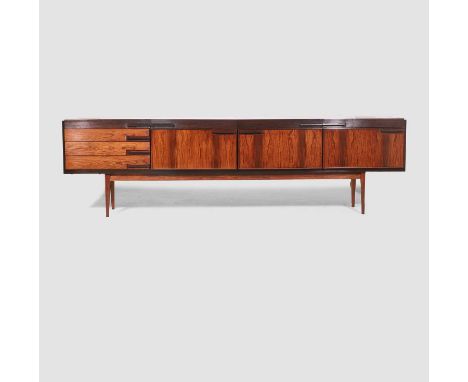 § Danish,  a rosewood sideboard, c.1960s, with a bank of three drawers to the left, three drop-down door sections to the cent