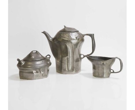 Kayserzinn, an Art Nouveau pewter tea set, c.1900, German, comprising a teapot, milk jug and lidded sugar bowl, decorated wit