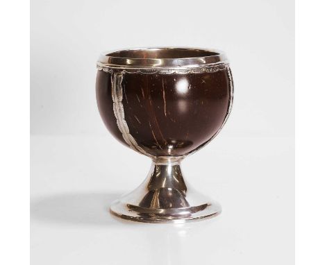 Robert Stocker, a mounted and lined silver 'coconut' cup, stamped 'RS' and for London 1903,the cup on a circular foot, 12cm d