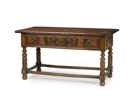 FLEMISH WALNUT HALL TABLE  PART 17TH CENTURY   the two board cleated top above a moulded panel frieze with a central drawer, 