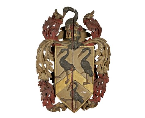 CARVED AND POLYCHROMED COAT OF ARMS  18TH/EARLY 19TH CENTURY   the shield shaped field with a chevron and three herons, enclo