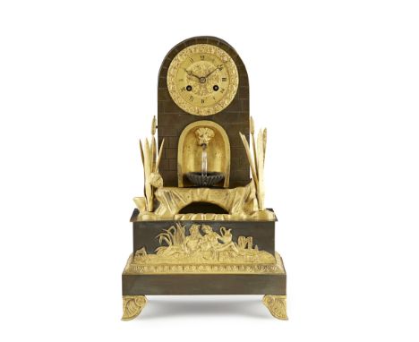 FRENCH EMPIRE GILT AND PATINATED METAL MANTEL CLOCK  EARLY 19TH CENTURY   the circular flower cast dial with a Roman number c