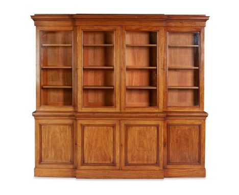 VICTORIAN MAHOGANY BREAKFRONT BOOKCASE  19TH CENTURY  the moulded cornice above glazed doors opening to shelves; the lower pa
