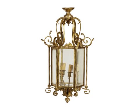 GEORGIAN STYLE BRASS HALL LANTERN  19TH CENTURY   the scrolling corona with bell flower trails, above an hexagonal glazed pan