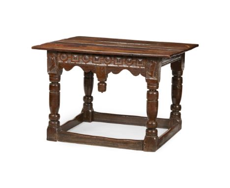 CHARLES II OAK TABLE  MID 17TH CENTURY   the rectangular top over a shaped frieze carved with geometric motifs, a stylised ow