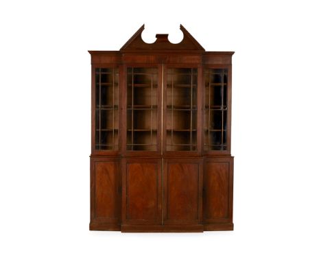 GEORGE III MAHOGANY BREAKFRONT BOOKCASE  18TH CENTURY   the broken arch pediment over a moulded cornice above astragal glazed