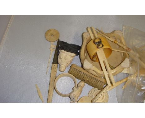 Bag of assorted antique and vintage carved resin, bone and ivory oddments