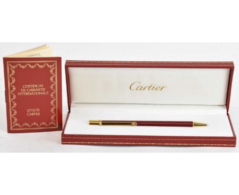 CARTIER; a boxed ballpoint pen, with original certificate guarantee, booklet and outer box.