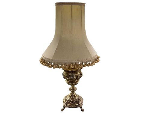 A modern brass lamp in the classical style, height to top of fitment 58cm, with an associated shade.