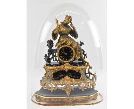 A late 19th century French gilt metal and ormolu mounted figural mantel clock, the black enamel dial set with Roman numerals 