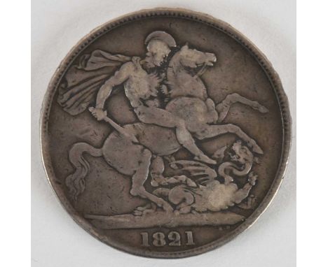 A George IV 1821 silver crown, first bust, St George on reverse, Secundo on edge.Condition Report: In the cataloguer's opinio