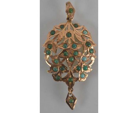 A Middle Eastern gold coloured metal hand beaten brooch, with pierced design representing a gathering of leaves set with smal