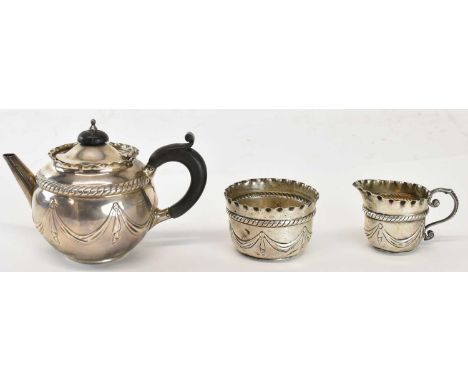 ELKINGTON &amp; CO; a cased late Victorian hallmarked silver three piece tea service comprising teapot, milk jug and sugar bo