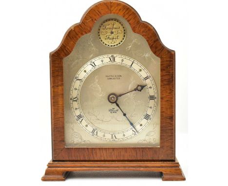 H LITTLE &amp; SON, LANCASTER; a burr walnut cased small mantel clock in the Georgian style, with floral patterned silvered f