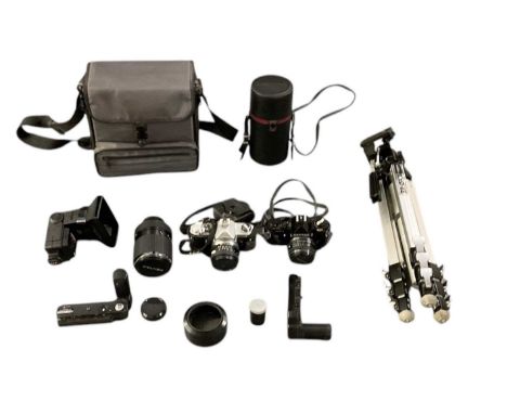 A quantity of vintage photography equipment, cameras and lenses including a Pentax MV1 camera, with SMC Pentax 1.1.7 lens, Pe