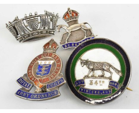 Four hallmarked silver military badges, comprising a WWI HMS Australian Infantry Battalion badge with white, green and blue e