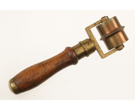 A little used brass concrete sectioning roller by GILCHRIST Glasgow with ash handle G++ 