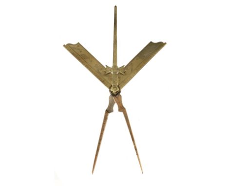 An unusual brass Masonic device with decoratively engraved square, compass and a Tyler's sword G+