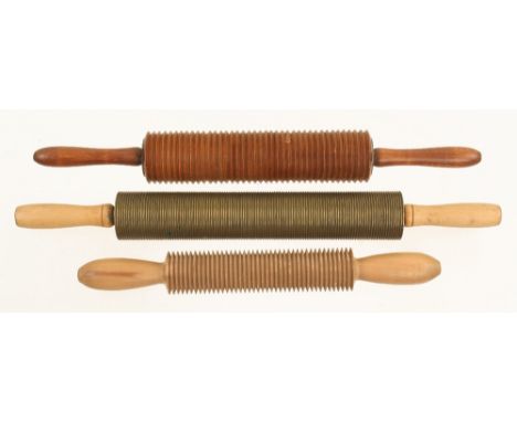 Two oat crusher rollers in mahogany and beech and another heavier roller in brass G++