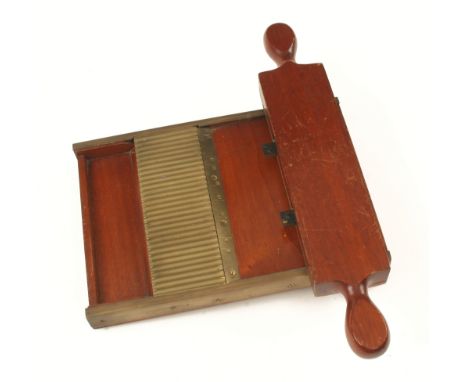 A little used mahogany and brass pill roller with drawer F