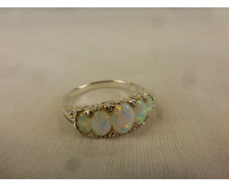 Silver ring with five graduated opals 