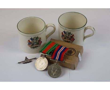 A Pair Of Full Size British WW2 Medals Contained In The Original Box Of Issue To Include The Defence Medal And British War Me