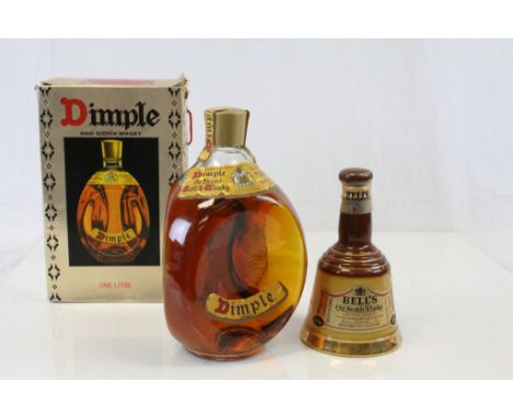 A boxed unopened bottle of Dimple Old Blended Scotch Whisky together with a bottle of Bells Old Scotch Whisky 18-9cl (2)