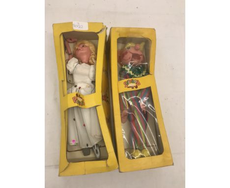 A boxed Pelham fairy puppet; together with a boxed Pelham clown puppet