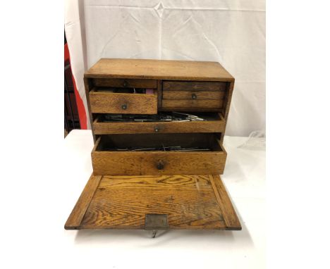 A vintage tool box and tools: drill bits, calipers, taps, dies etc
