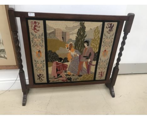An early 20th century embroidered firescreen