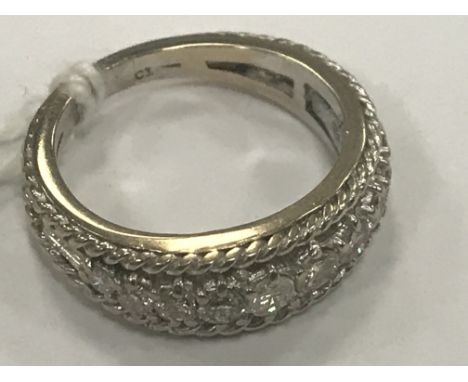 An 18ct diamond half eternity ring