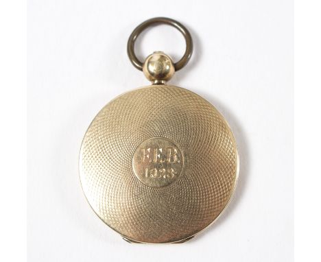 A William IV gold locket enclosing locks of hair, the engine-turned casing initialled and dated 1928, gross weight approximat